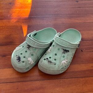 CROCS Kids Mint Green Clog Sandals with Dinosaur Charms